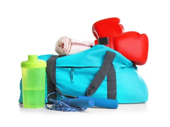 Sports bag and gym stuff on white background