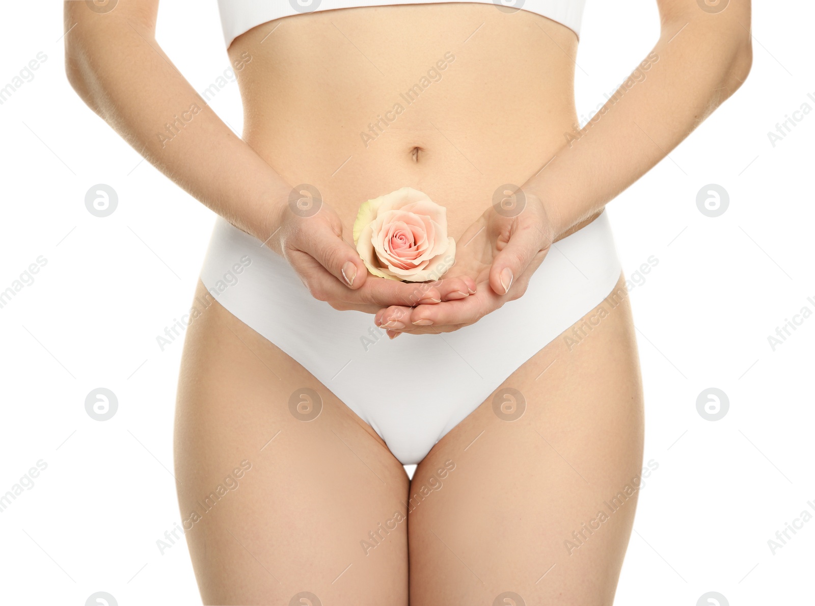 Photo of Gynecology. Woman in underwear with rose flower on white background, closeup