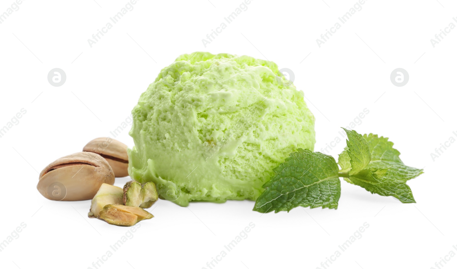 Photo of Scoop of delicious pistachio ice cream with mint and nuts on white background