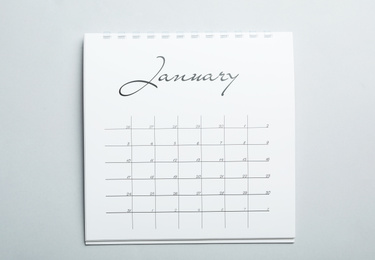 Photo of January calendar on light grey background, top view