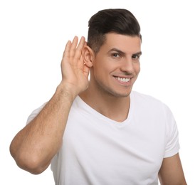 Photo of Man showing hand to ear gesture on white background