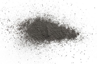 Photo of Pile of black dust scattered on white background, top view