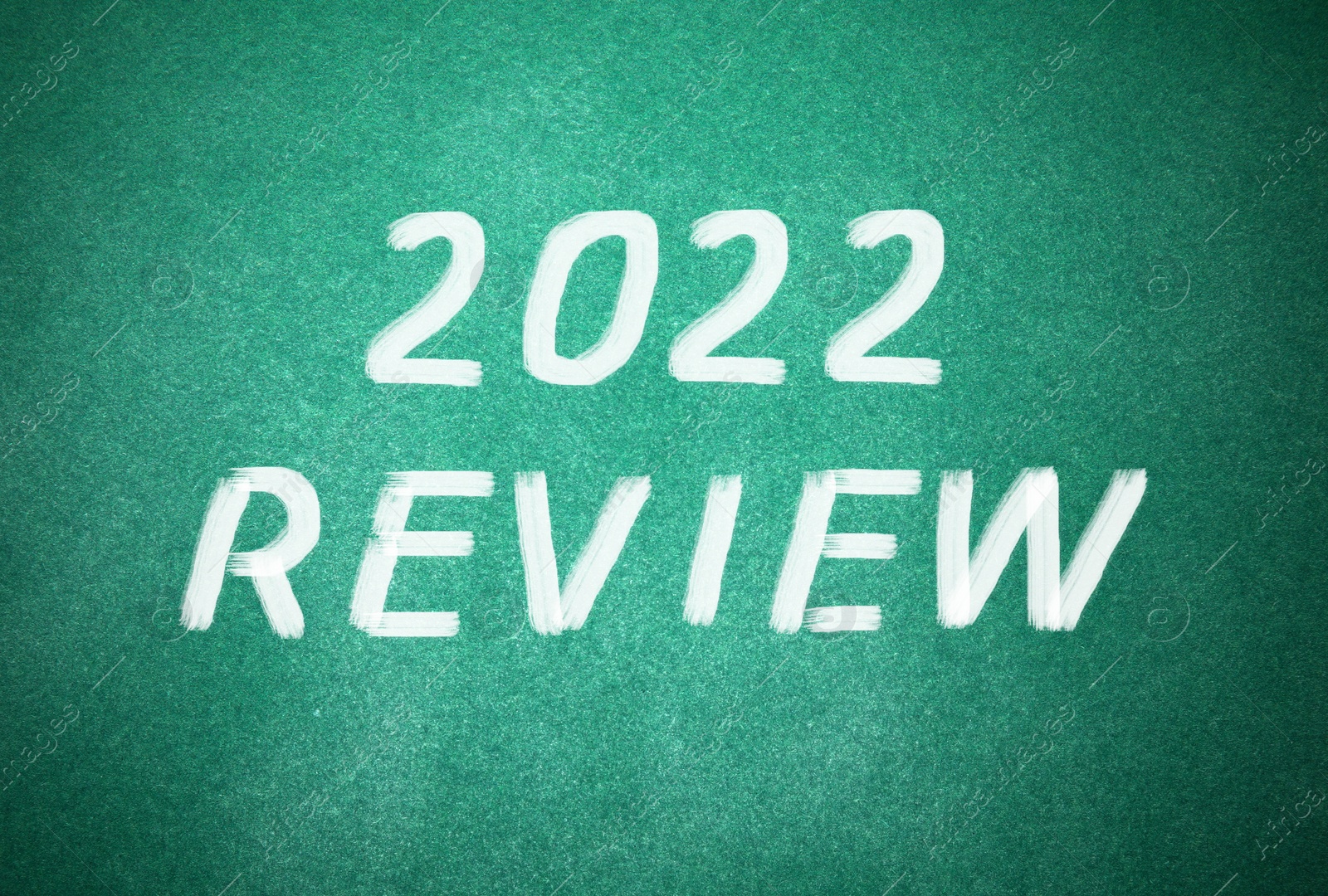 Illustration of Text 2022 Review written on green chalkboard