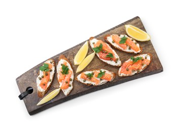 Photo of Tasty canapes with salmon, capers, lemon and cream cheese isolated on white, top view