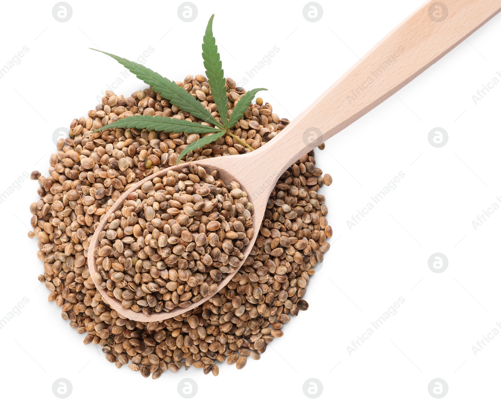 Photo of Wooden spoon, hemp seeds and leaf on white background, top view