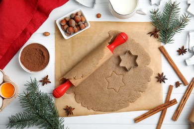 Homemade Christmas cookies. Flat lay composition with dough on white wooden table