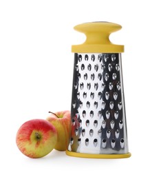 Photo of Stainless steel grater and fresh apples on white background