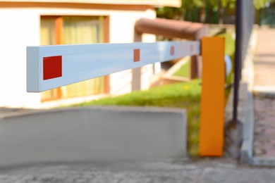 Photo of Closed boom barrier on autumn day outdoors, closeup