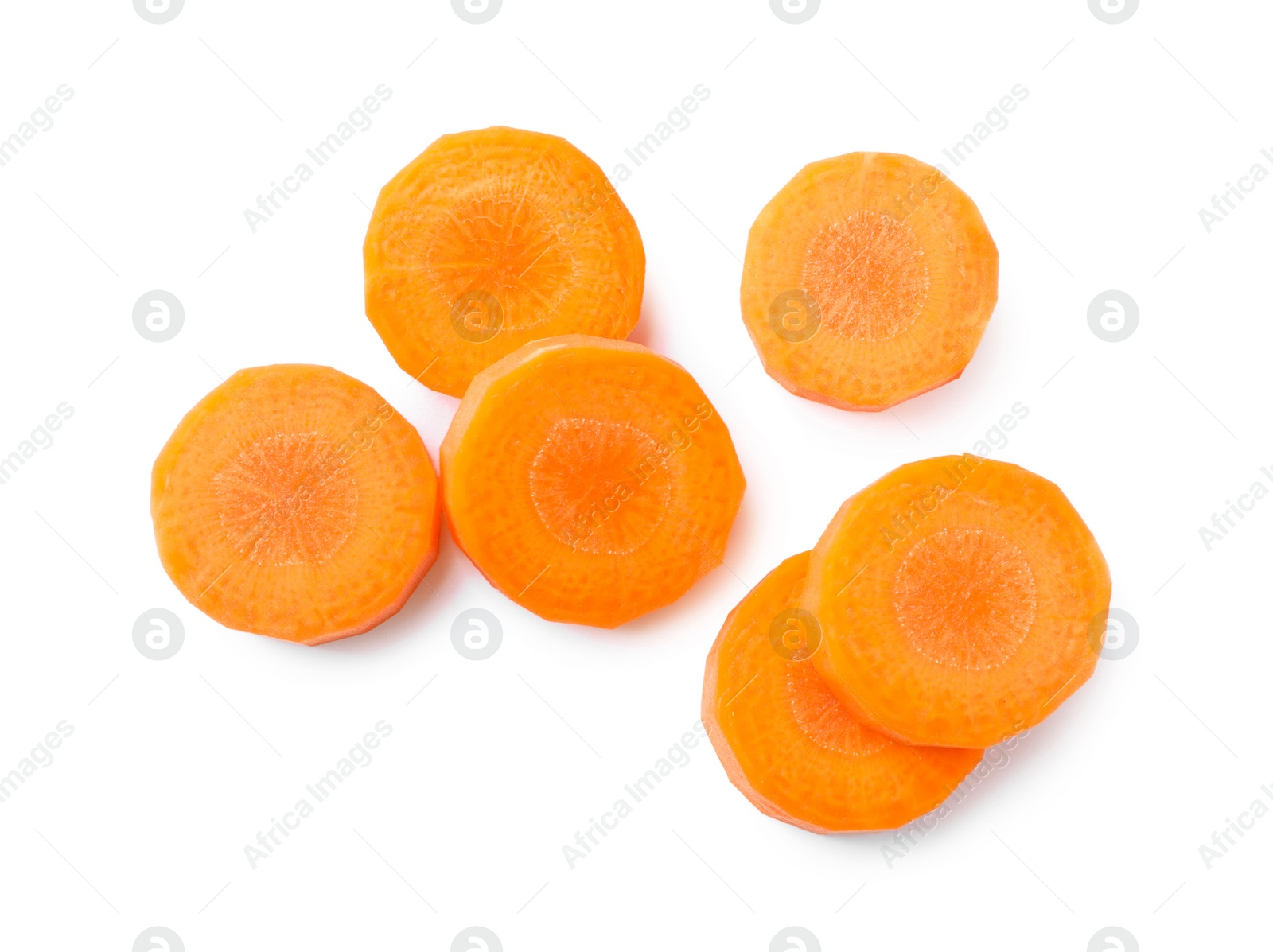 Photo of Slices of fresh ripe carrot on white background, top view