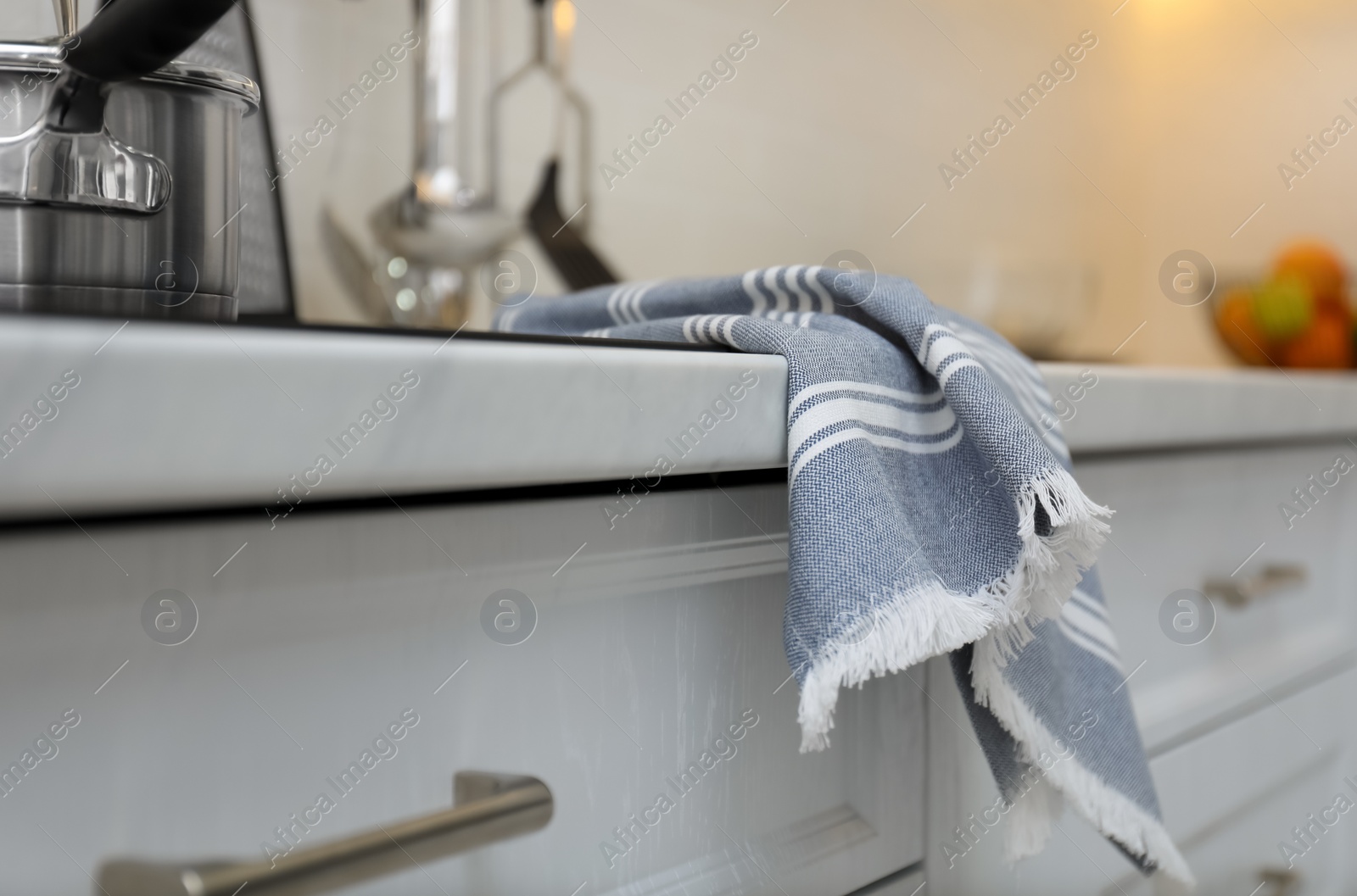 Photo of Clean kitchen towel on counter at home, closeup