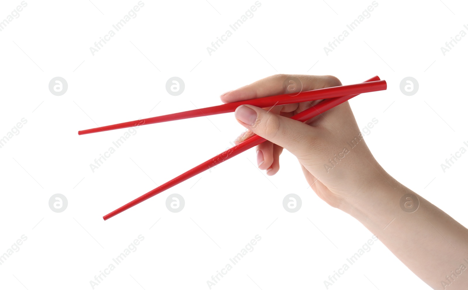 Photo of Woman holding pair of red chopsticks on white background, closeup