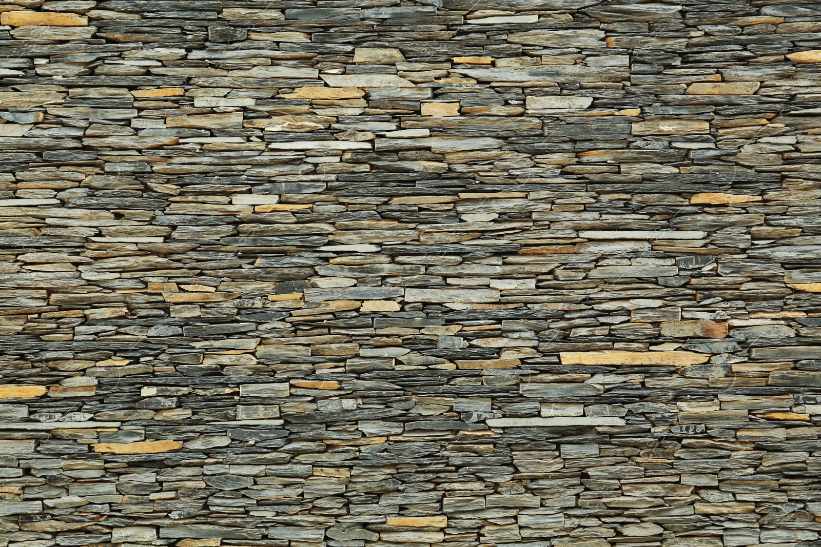 Photo of Texture of grey stone wall as background