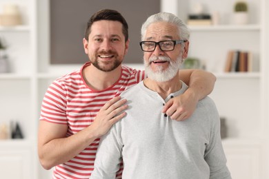 Happy son and his dad at home