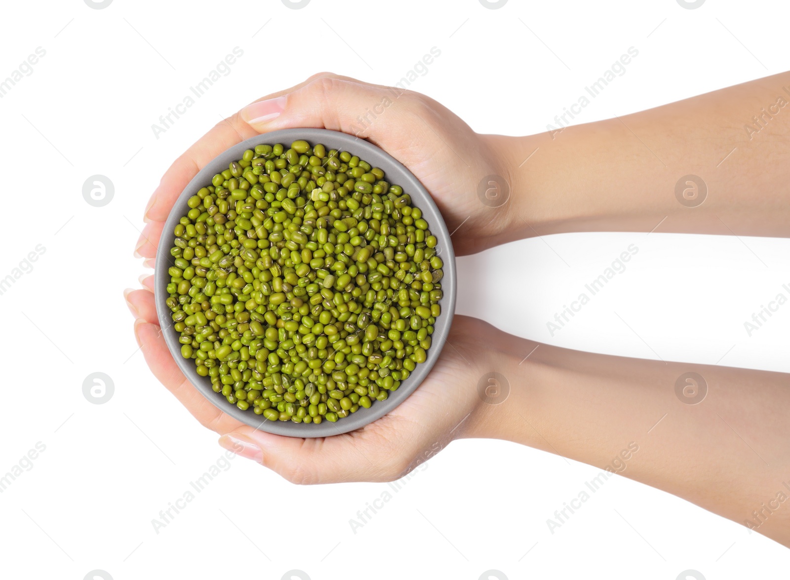 Photo of Woman holding bowl with green mung beans on white background, top view