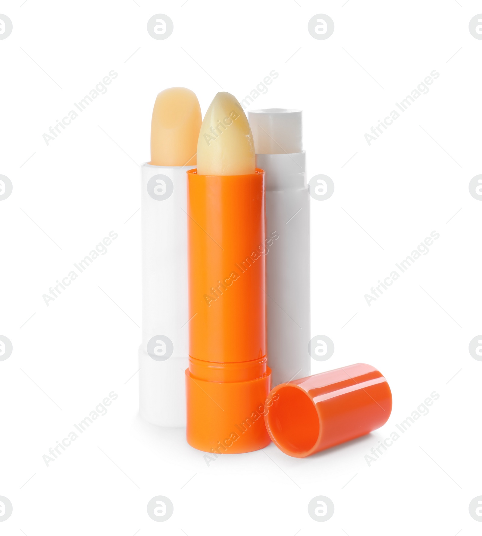 Photo of Sun protection lip balms on white background