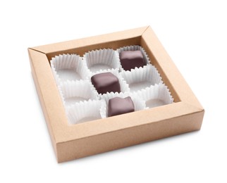 Photo of Partially empty box of chocolate candies isolated on white