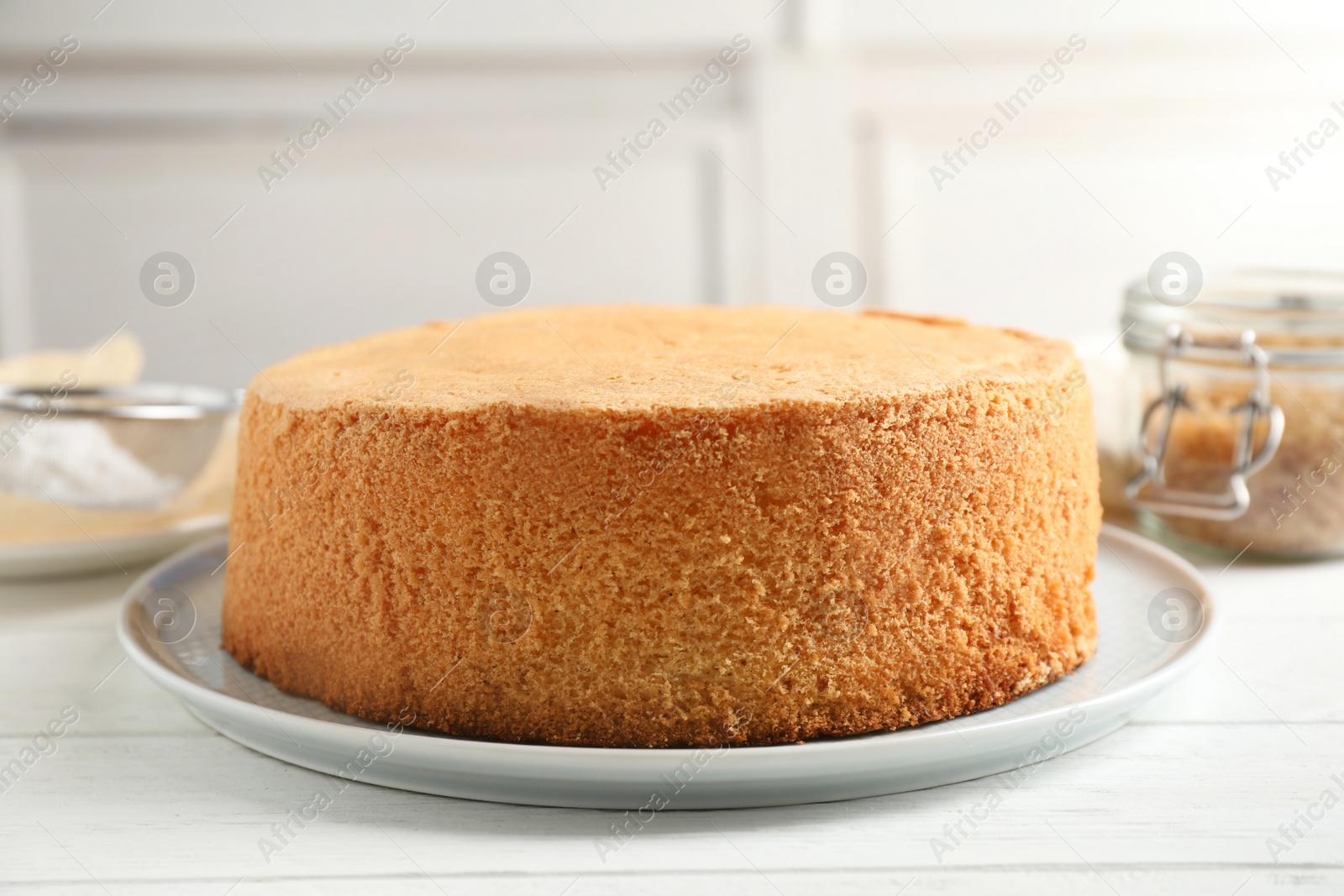 Photo of Delicious fresh homemade cake on white wooden table