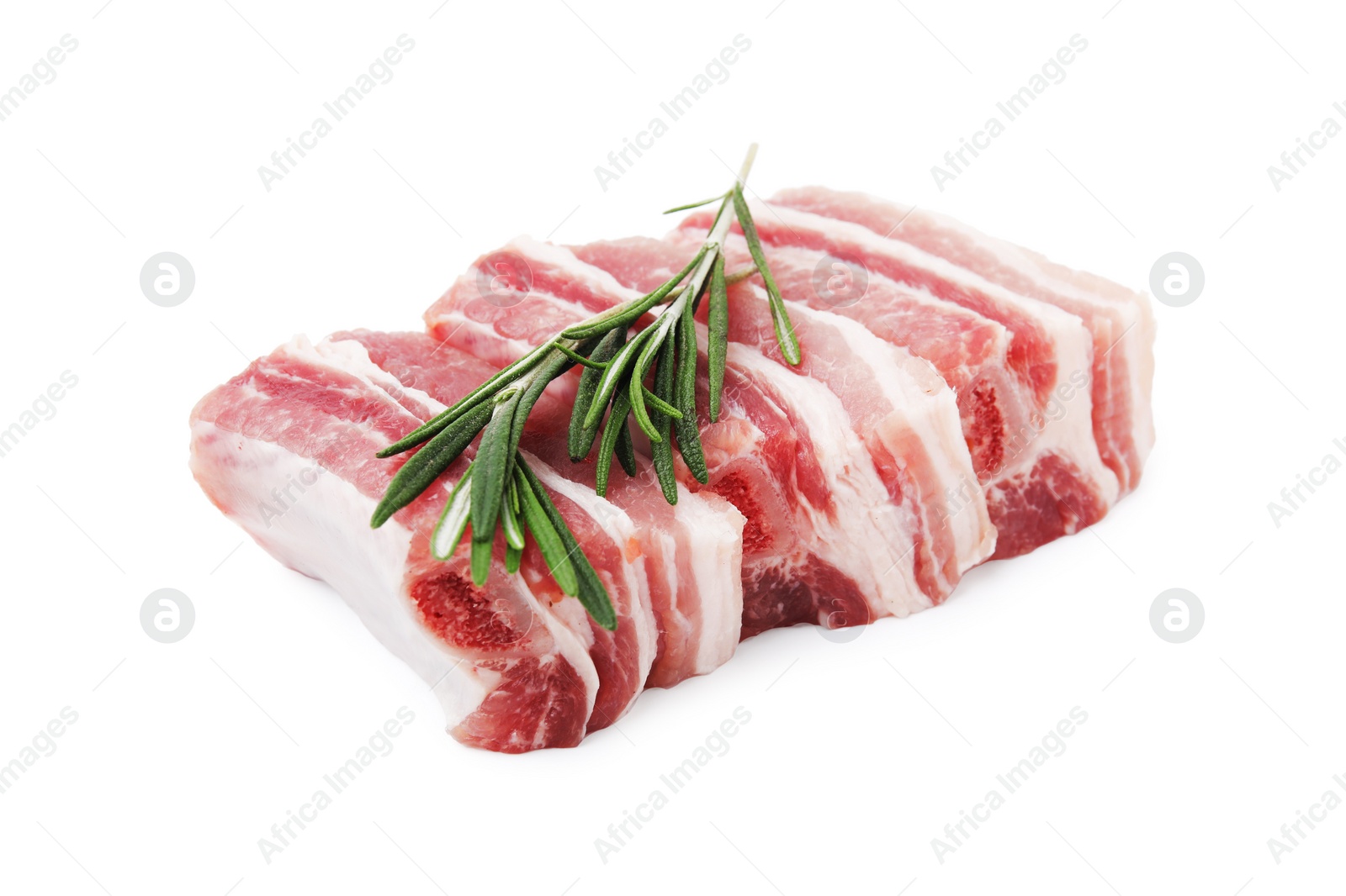 Photo of Cut raw pork ribs with rosemary isolated on white