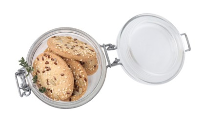 Photo of Cereal crackers with flax, sesame seeds and thyme in jar isolated on white, top view