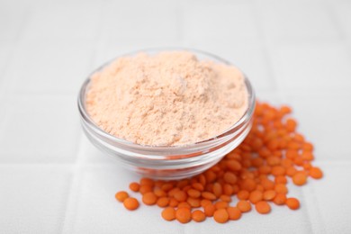 Bowl of lentil flour and seeds on white tiled table