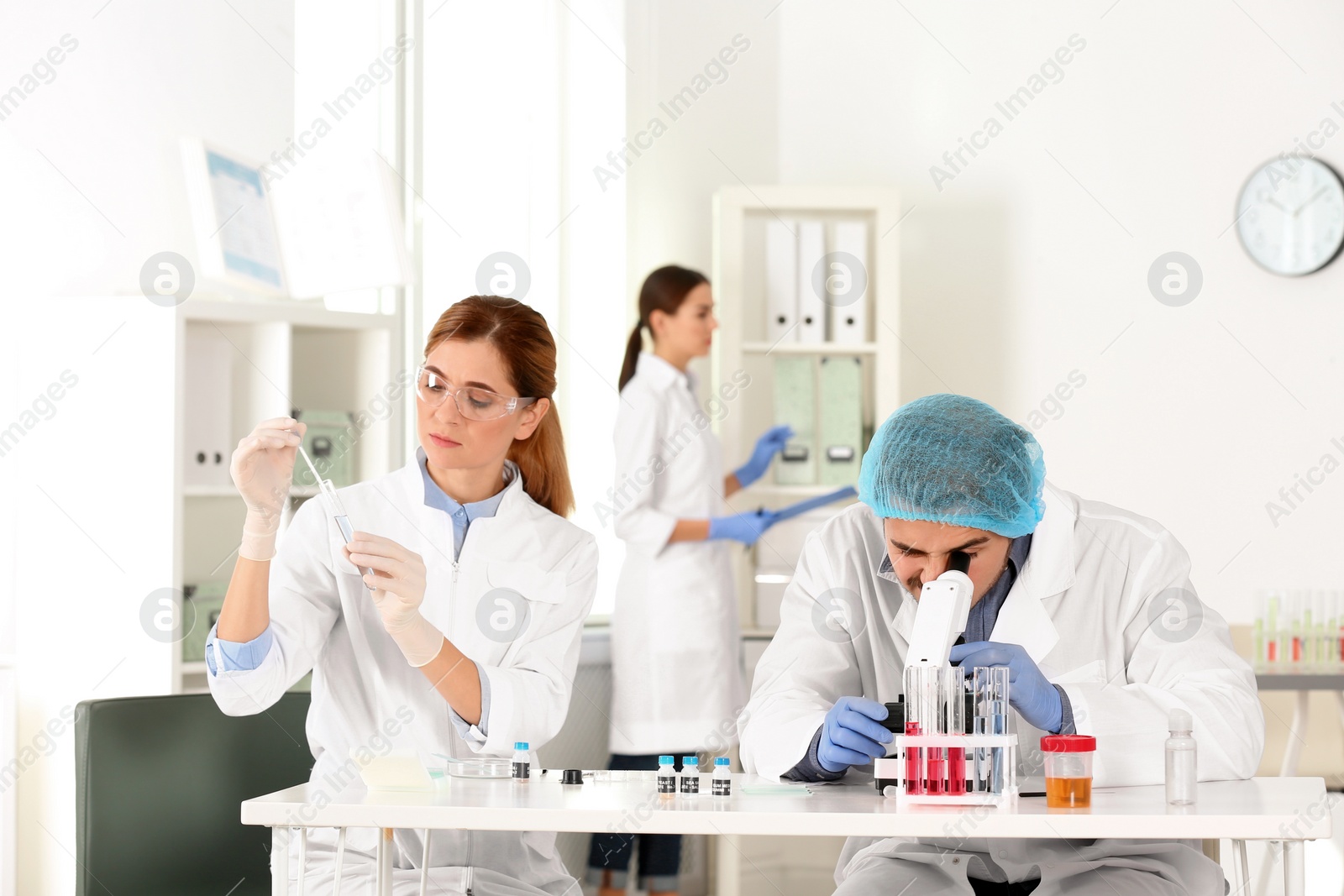 Photo of Scientists working in laboratory. Research and analysis