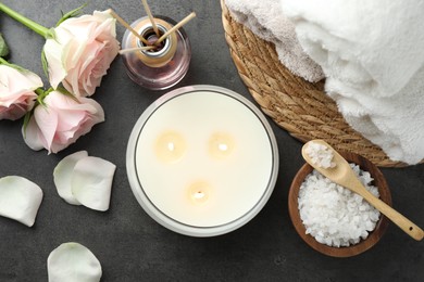 Photo of Flat lay composition with different spa products and rose flowers on grey table