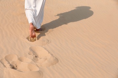 Photo of Jesus Christ walking in desert, closeup. Space for text