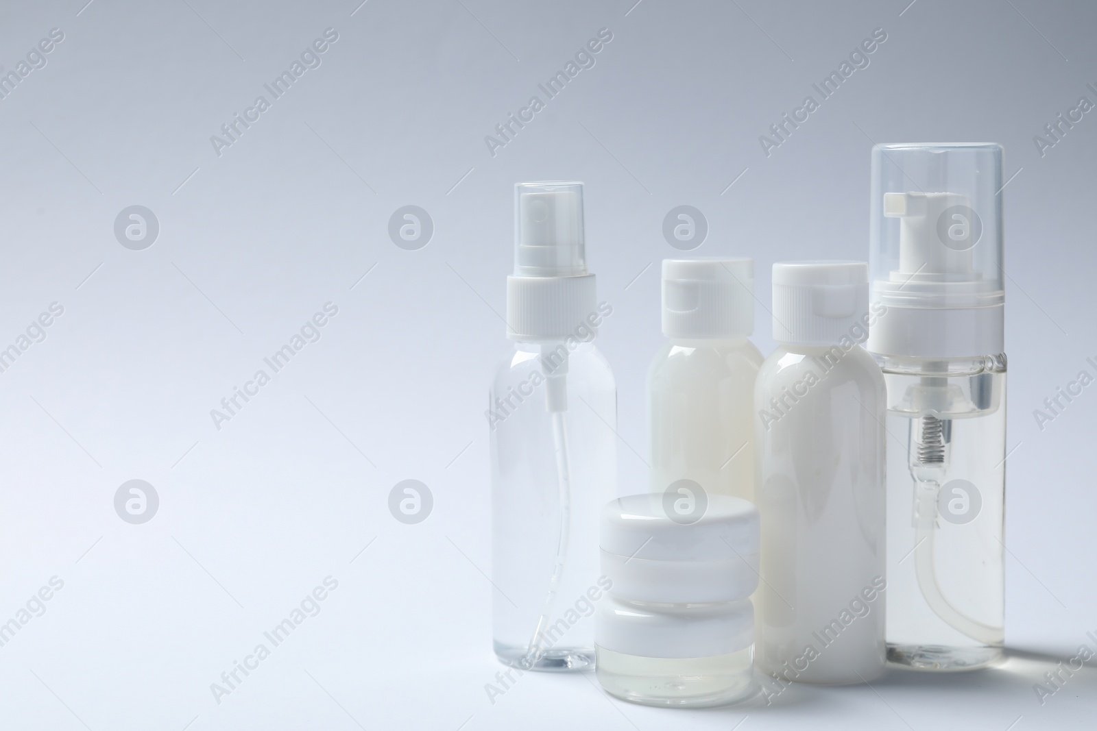 Photo of Cosmetic travel kit on white background, space for text. Bath accessories