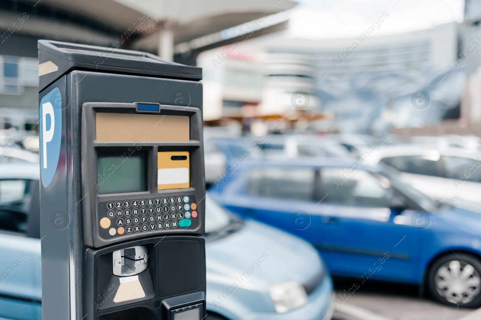 Photo of Modern parking meter on city street. Space for text