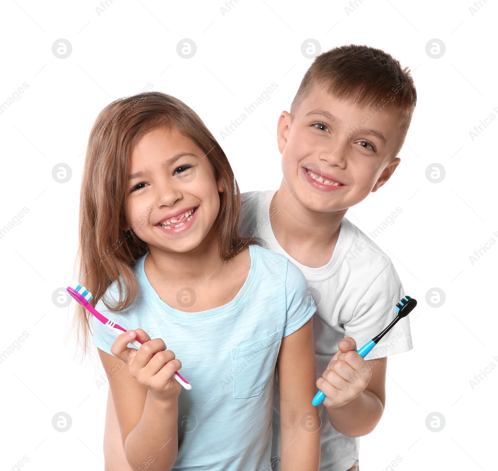 Photo of Portrait of cute children with toothbrushes on white background