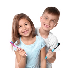 Photo of Portrait of cute children with toothbrushes on white background