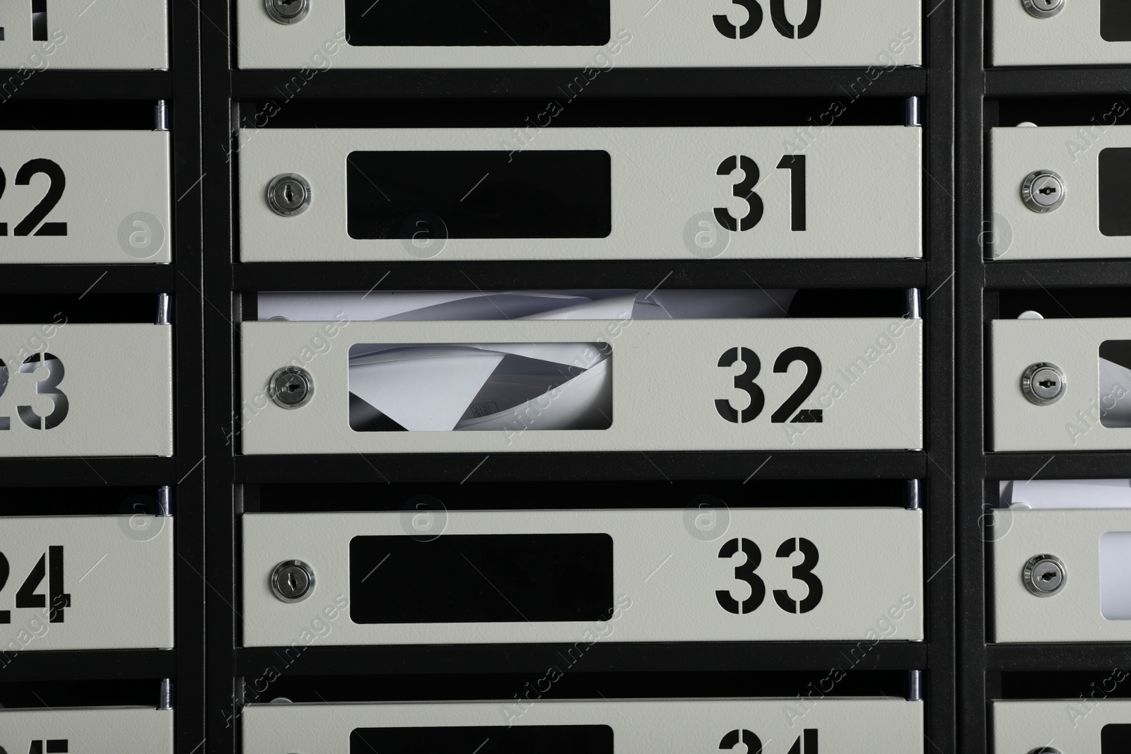 Photo of New mailboxes with keyholes, numbers and receipts as background