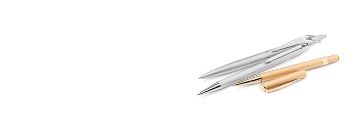 Image of Set of golden and silver pens on white background