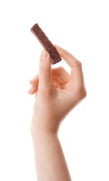 Woman holding crispy rusk on white background, closeup