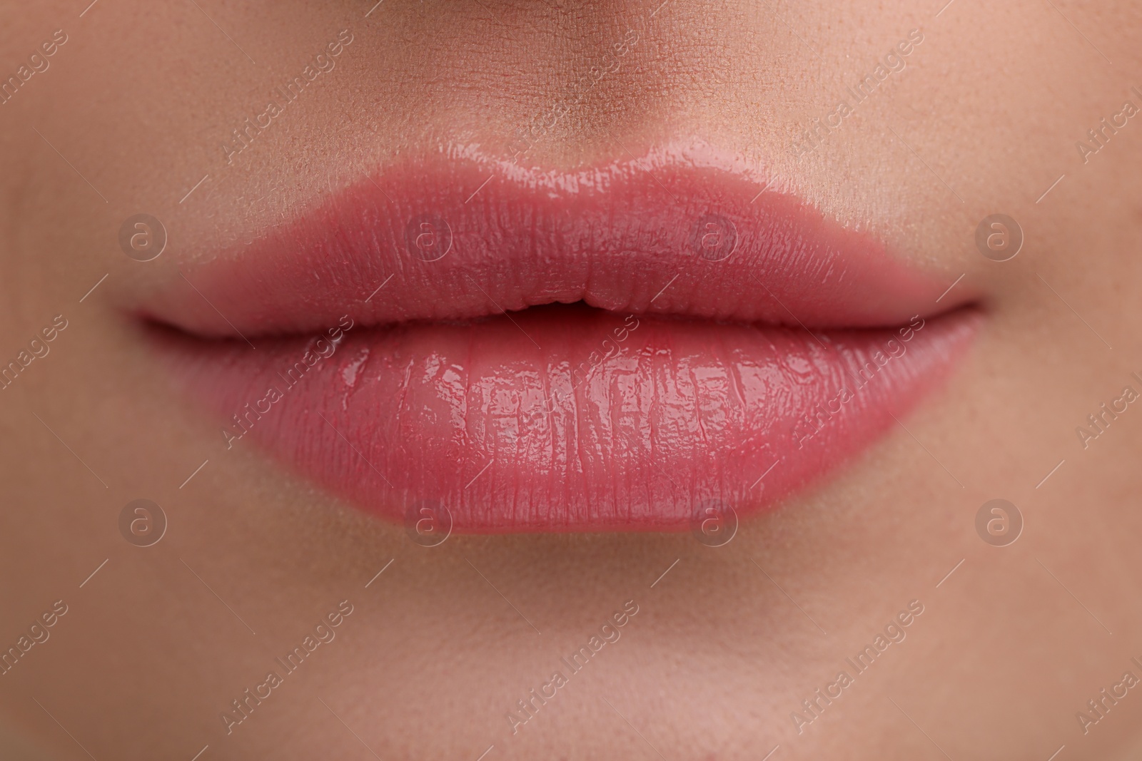 Photo of Young woman with beautiful full lips as background, closeup