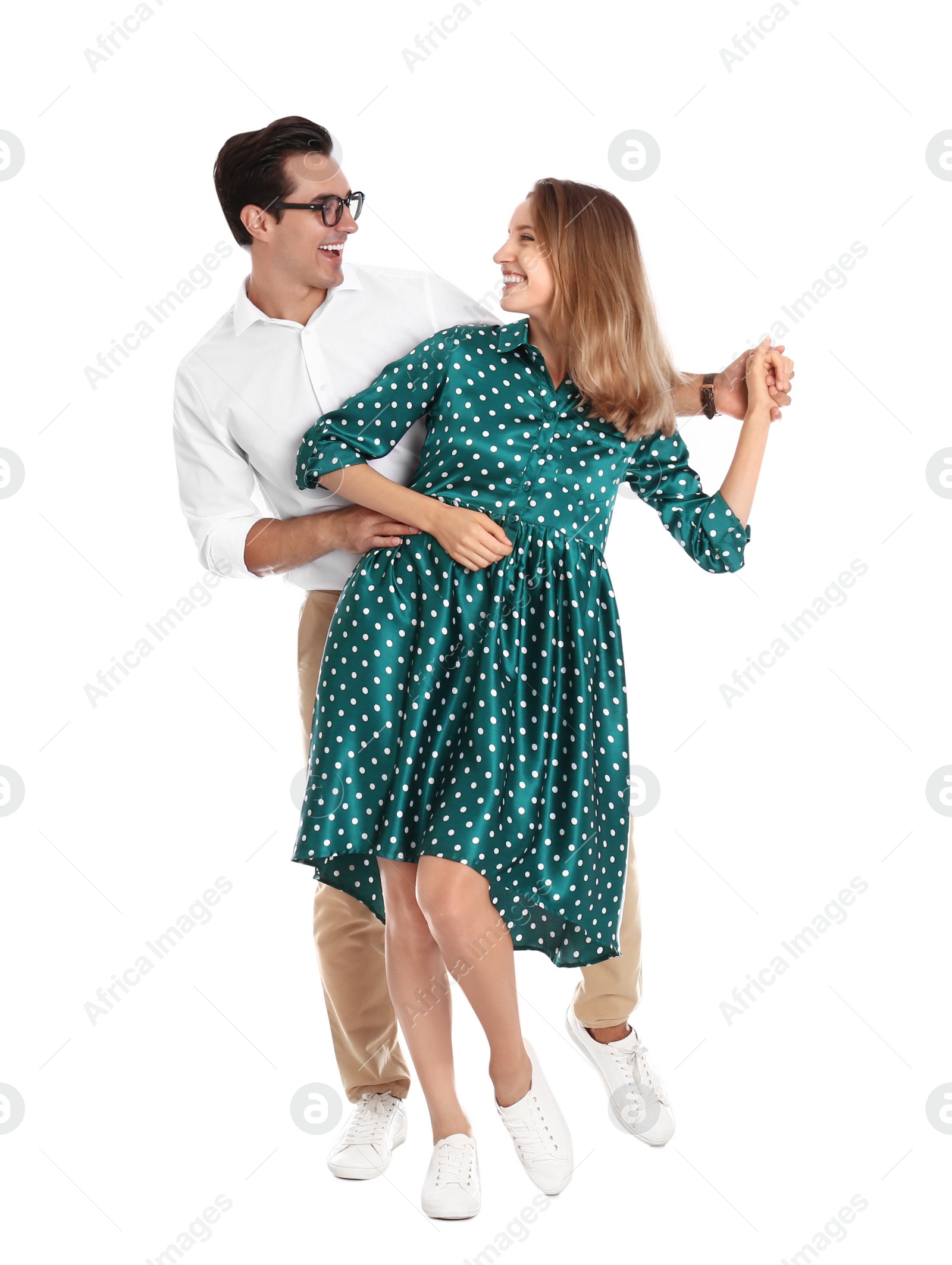 Photo of Beautiful young couple dancing on white background