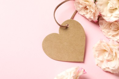 Photo of Happy Mother's Day. Beautiful flowers with blank heart shaped card on pink background