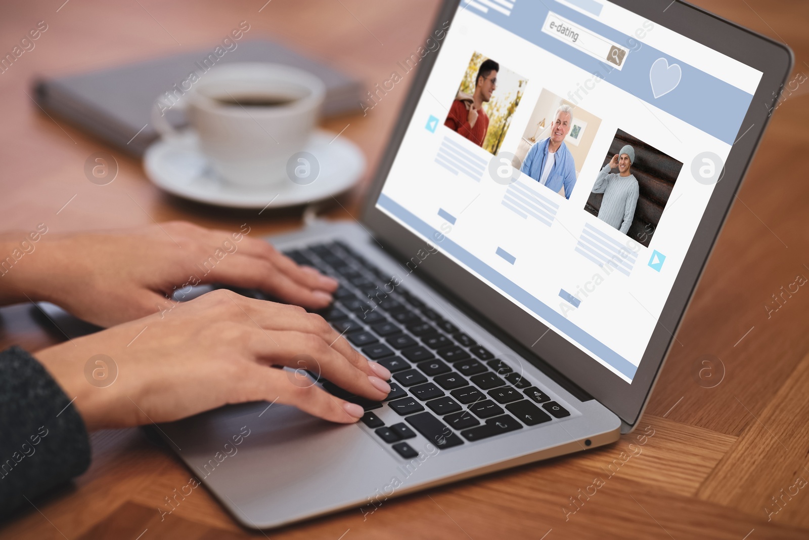 Image of Young woman visiting online dating site via laptop at table, closeup