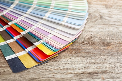 Photo of Color palette samples on wooden background