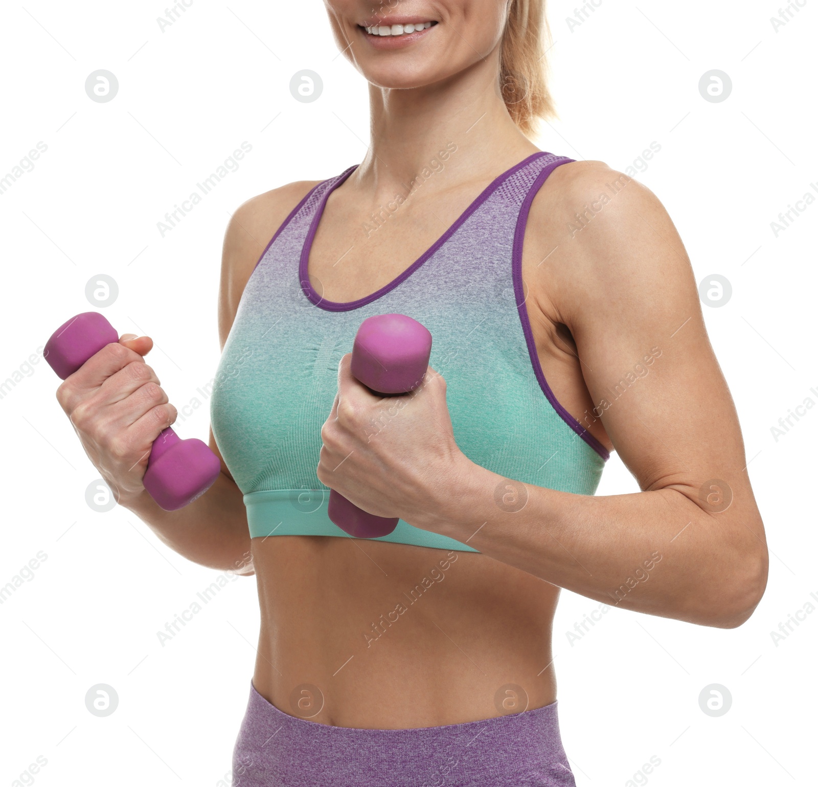 Photo of Sportswoman exercising with dumbbells on white background, closeup