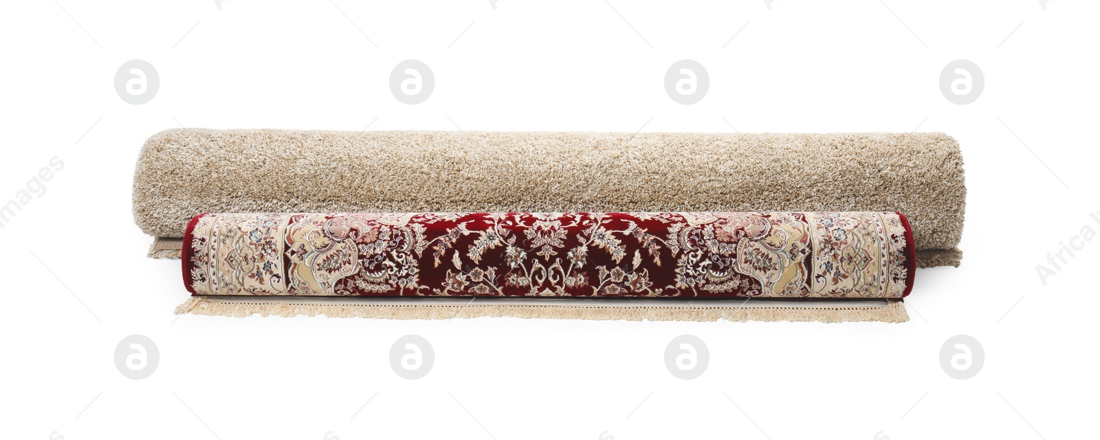 Photo of Rolled carpets on white background. Interior element