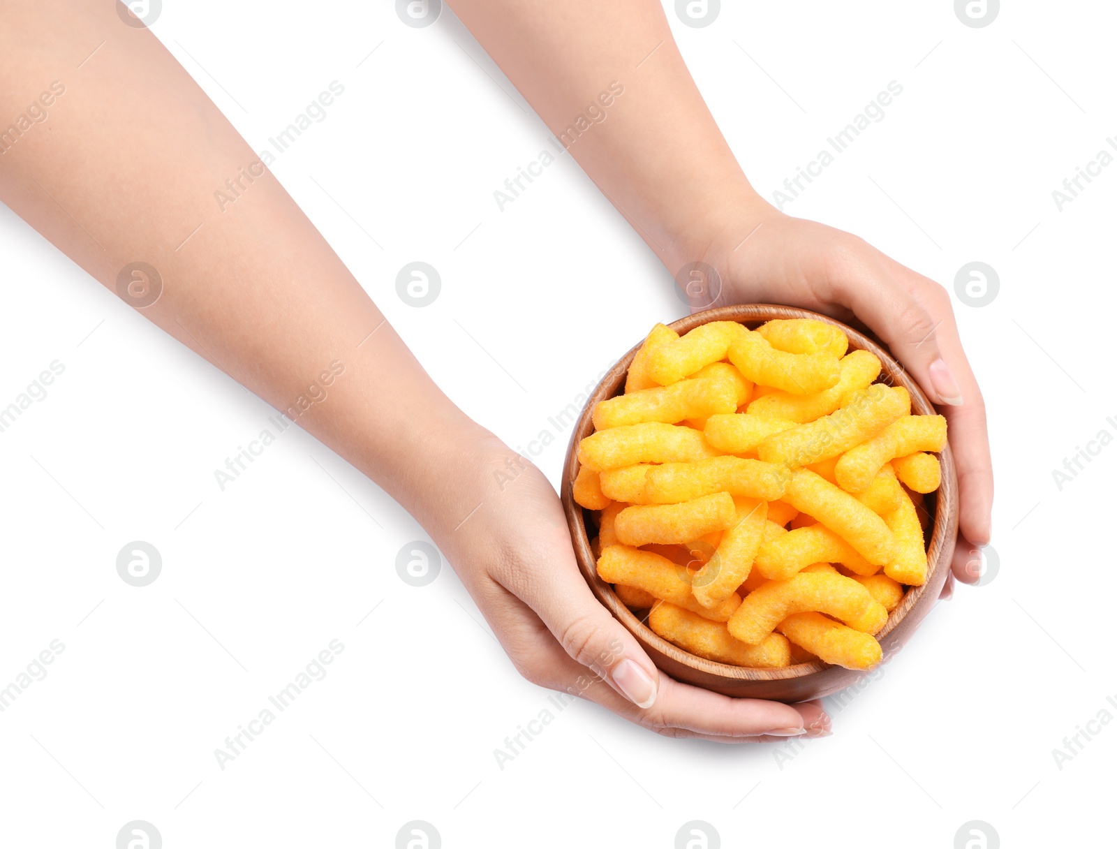 Photo of Woman holding bowl of crunchy cheesy corn sticks on white background, top view