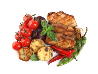 Photo of Tasty grilled vegetables, meat, fresh cherry tomatoes and basil isolated on white, top view