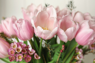 Photo of Beautiful bouquet with spring pink tulips on light background, closeup
