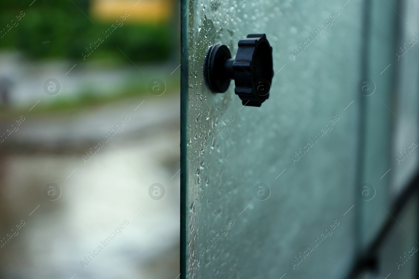 Photo of Open tram window with rain drops, closeup view
