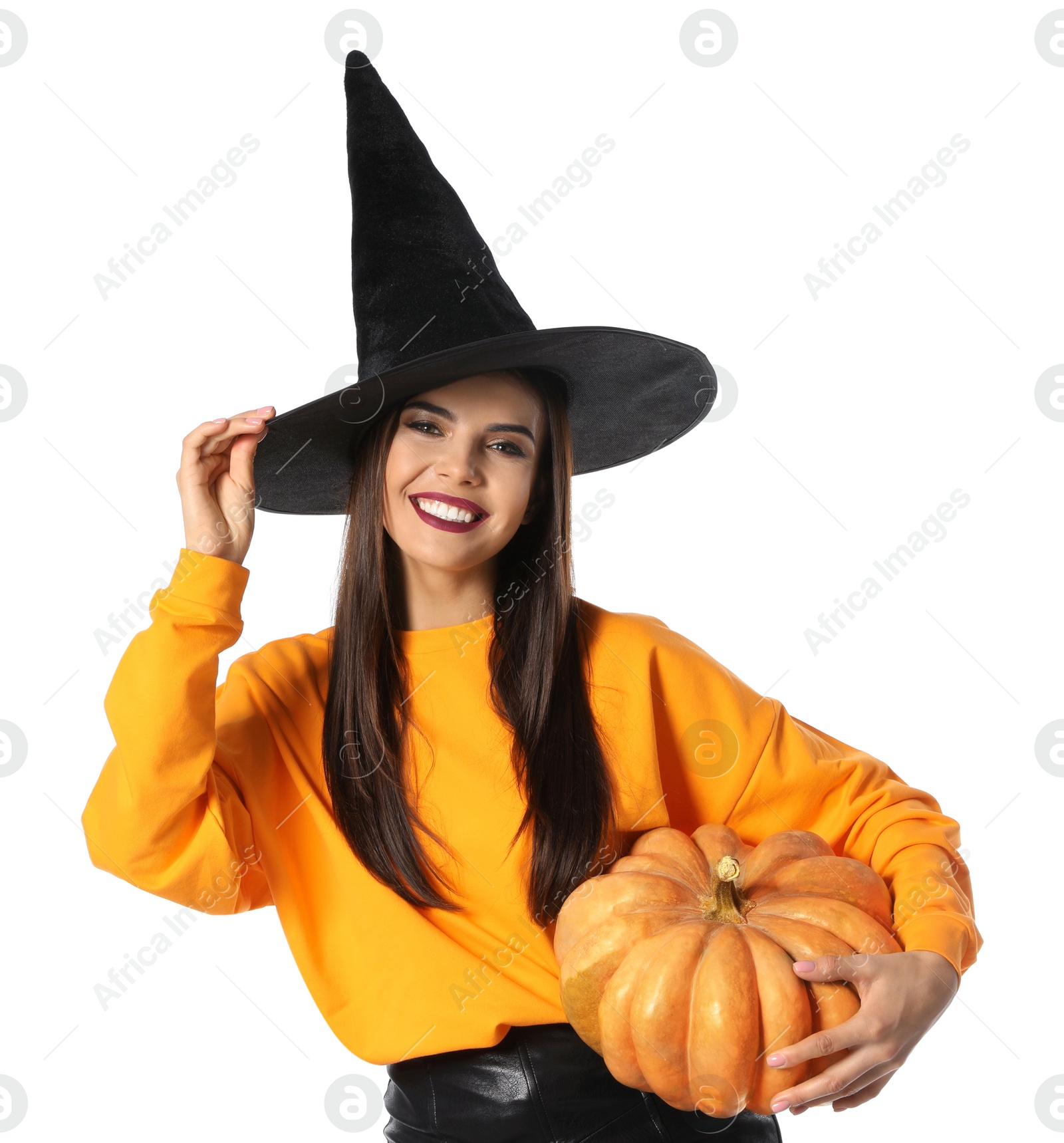 Photo of Beautiful woman wearing witch costume with pumpkin for Halloween party on white background