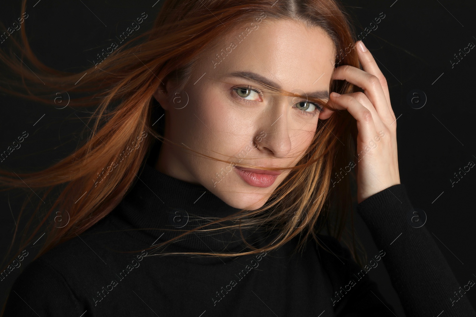 Photo of Evil eye. Young woman with scary eyes on black background