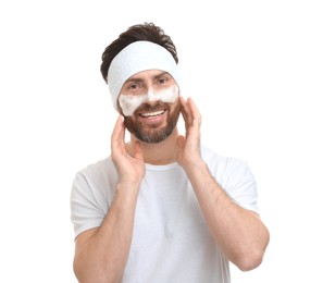 Photo of Man with headband washing his face on white background