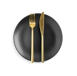 Clean plate with golden cutlery on white background, top view