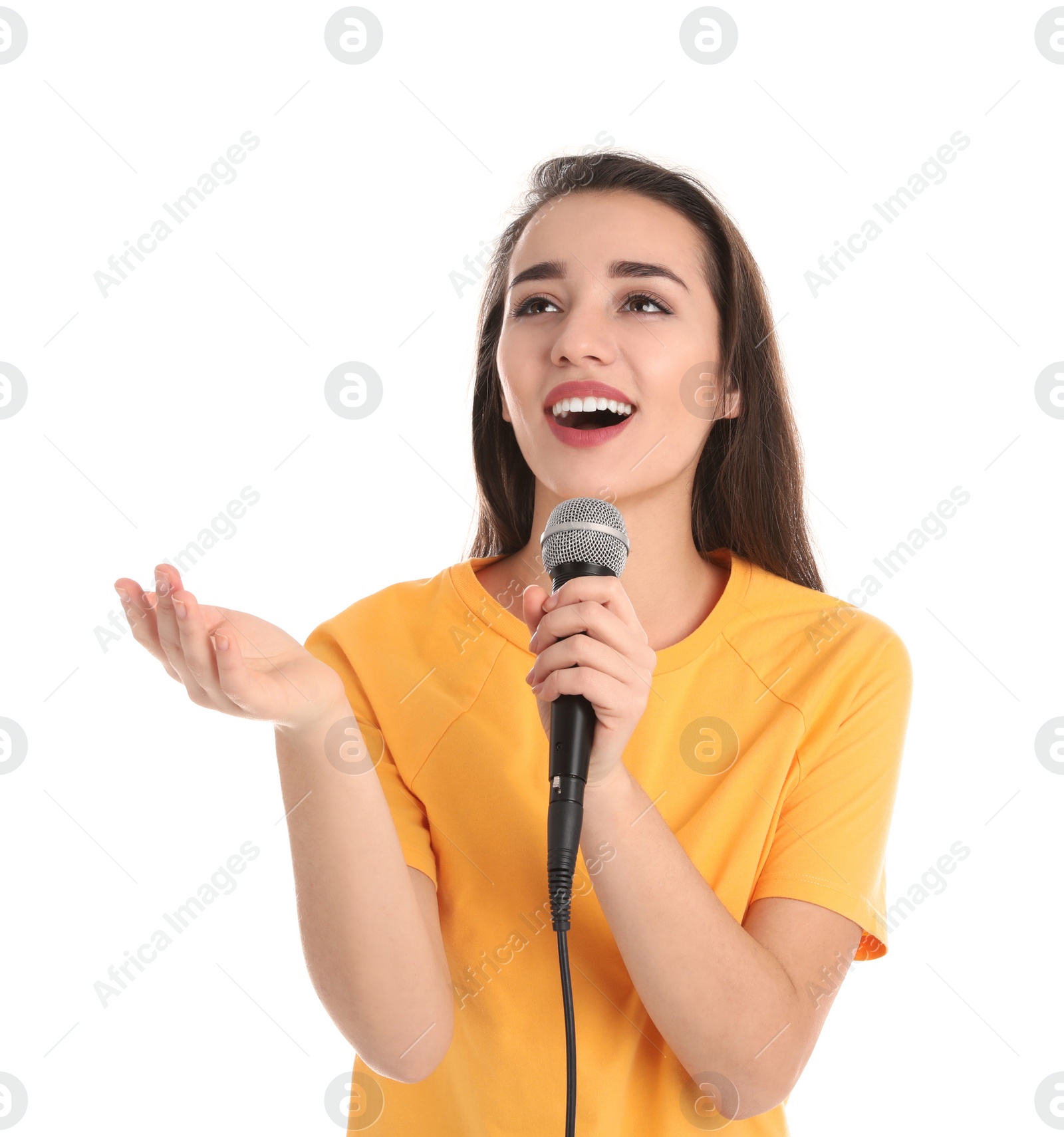 Photo of Young woman wearing casual clothes singing in microphone on white background